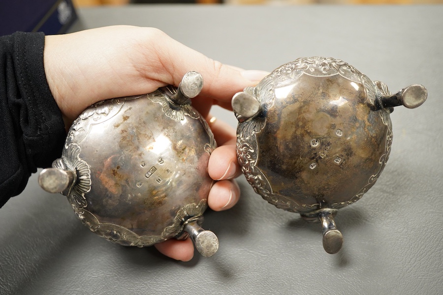 A pair of Victorian embossed silver bun salts, by Elkington & Co, Birmingham, 1852/3, top diameter 65mm, 7.7oz.